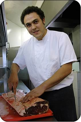 Chef at the Devonshire Fell Mehdi Boukemach prepares the Luing sirloin roast for the launch dinner. 