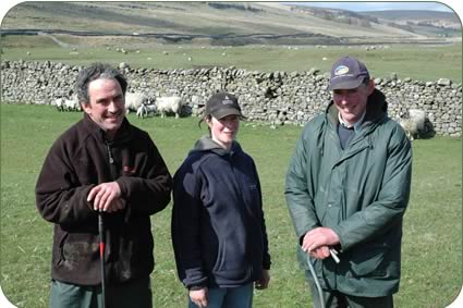 Richard (with cap) and Bryan Coates and Mary Dawson and Swaledale ewes and lambs