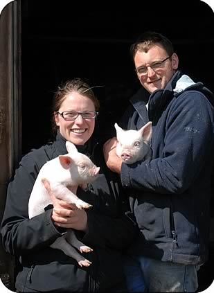 Michelle and Shaun Partington with Middle White piglets