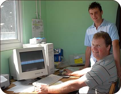 Malcolm and his son David and at the farm computer