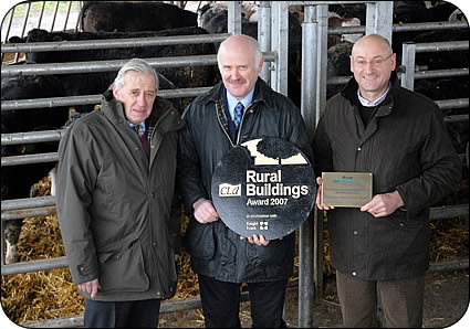 CLA regional resident Charles Harle, left, presents the award for best new build in England and Wales to John Allinson, centre, and Geoff Simpson.