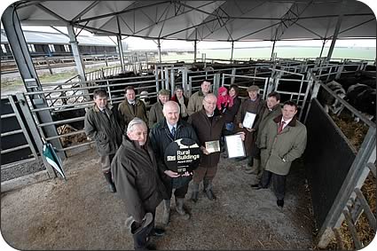 Front, left to right, Charles Harle presents John Allinson and Geoff Simpson with the CLA award for best new build in England and Wales at a Roundhouse building at Summerhouse Grange, near Darlington.