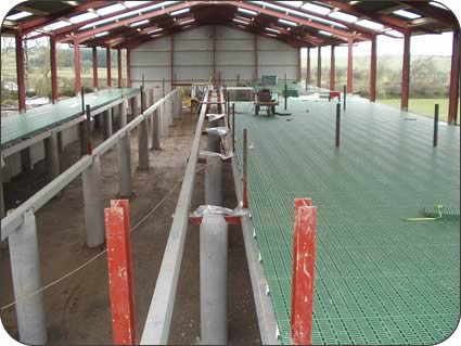 the building under construction with its slatted floor