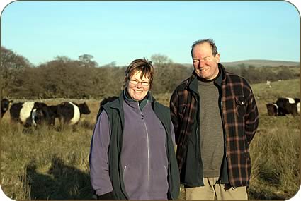Jane Eden and Chris Evans with Belted Galloway cows and calves