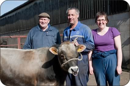 Left to right, Arnold Thompson, John and Caroline Elliott with six month old bull Farlam Ellens TV ED